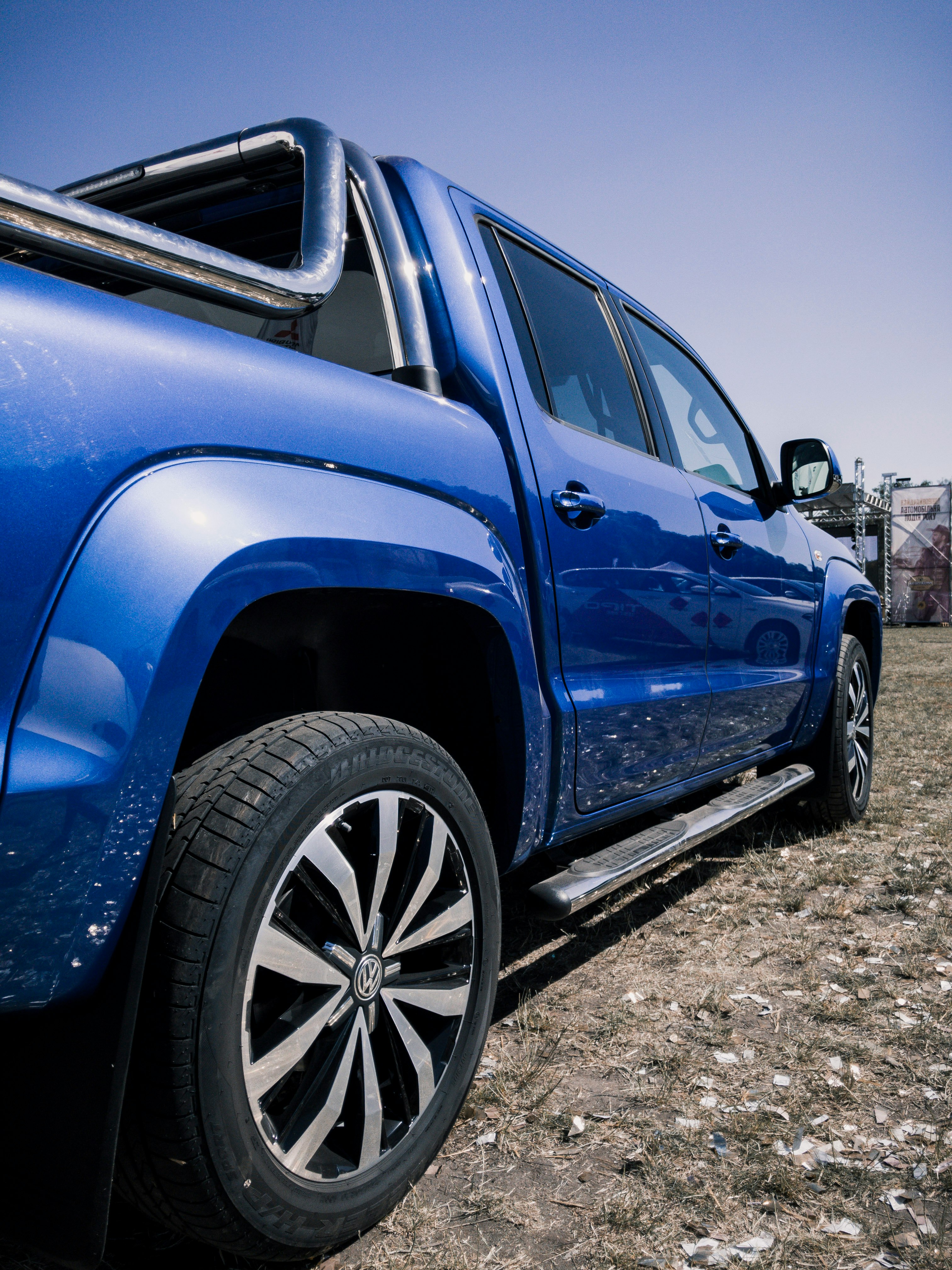 blue suv on gray dirt ground during daytime